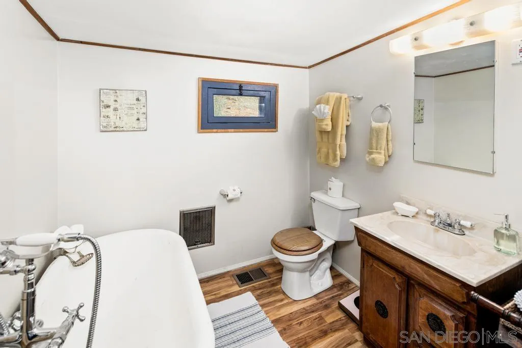 813 Pine Cone Drive Julian, CA 92036 - Photo 19 of 39 a bathroom with a sink and a mirror