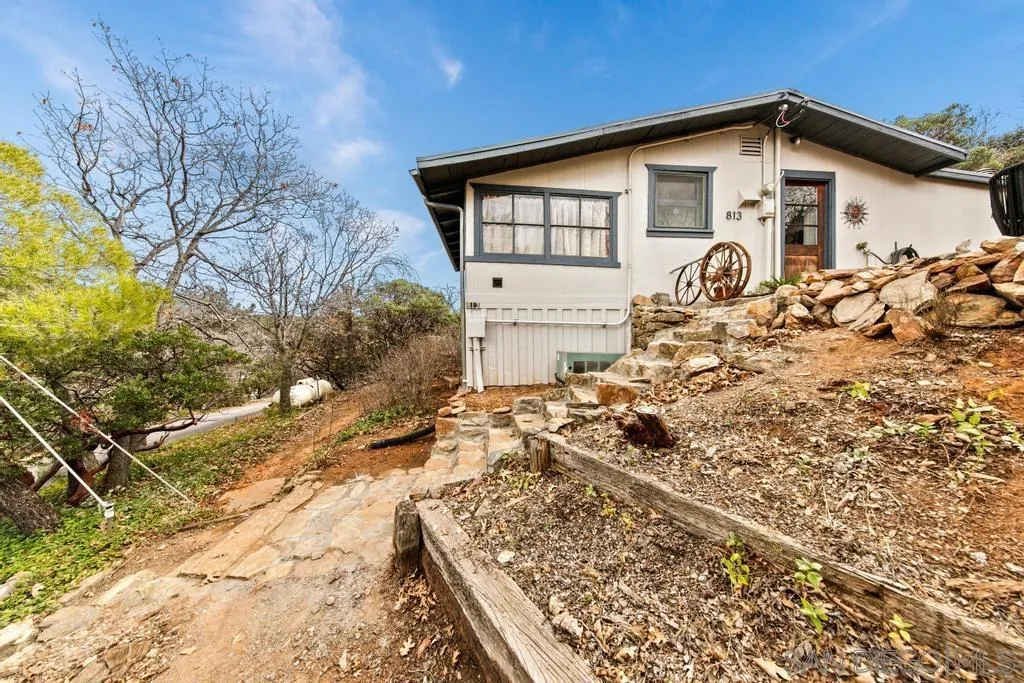 813 Pine Cone Drive Julian, CA 92036 - Photo 23 of 39 a front view of a house with garden