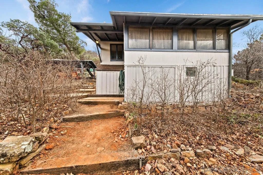 813 Pine Cone Drive Julian, CA 92036 - Photo 24 of 39 a front view of a house with a yard