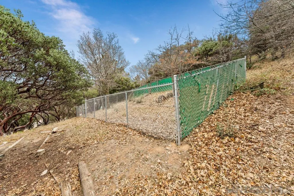 813 Pine Cone Drive Julian, CA 92036 - Photo 32 of 39 a view of a yard with wooden fence