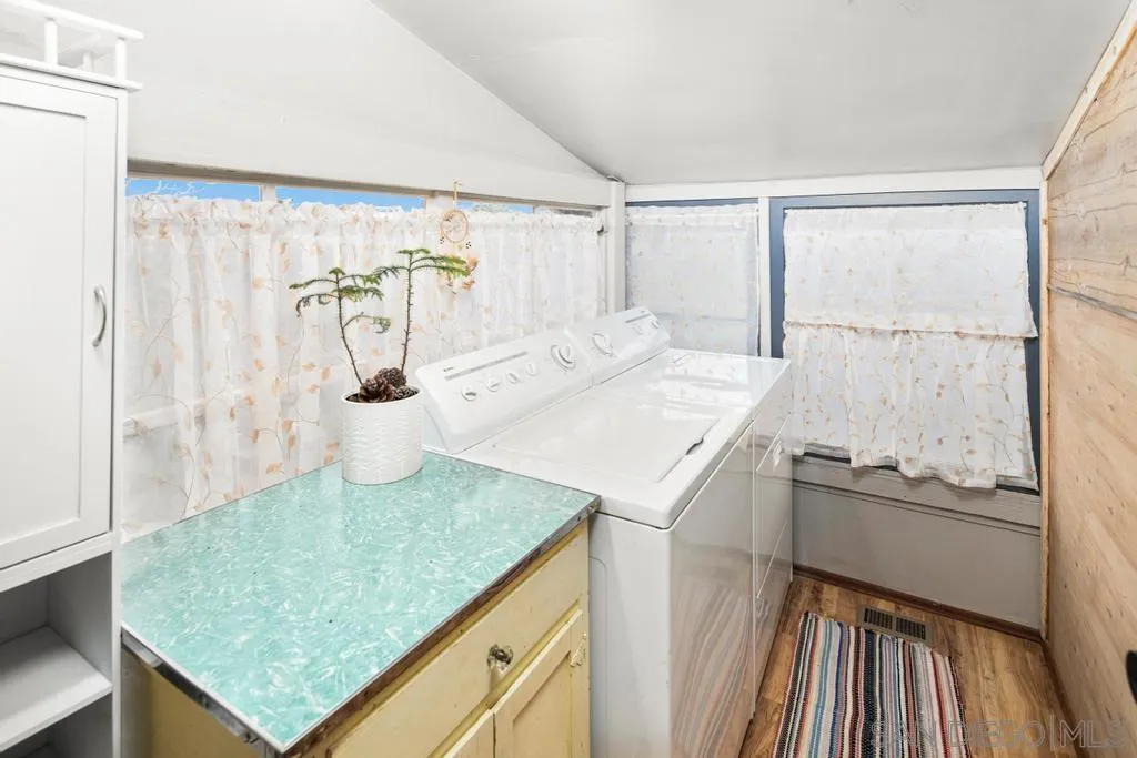 813 Pine Cone Drive Julian, CA 92036 - Photo 10 of 39 a kitchen with a sink a stove and chairs