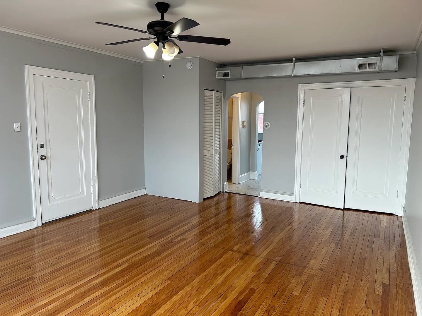 5701 West Roosevelt Road Cicero, IL 60804 - Photo 17 of 32 a view of empty room with wooden floor and fan