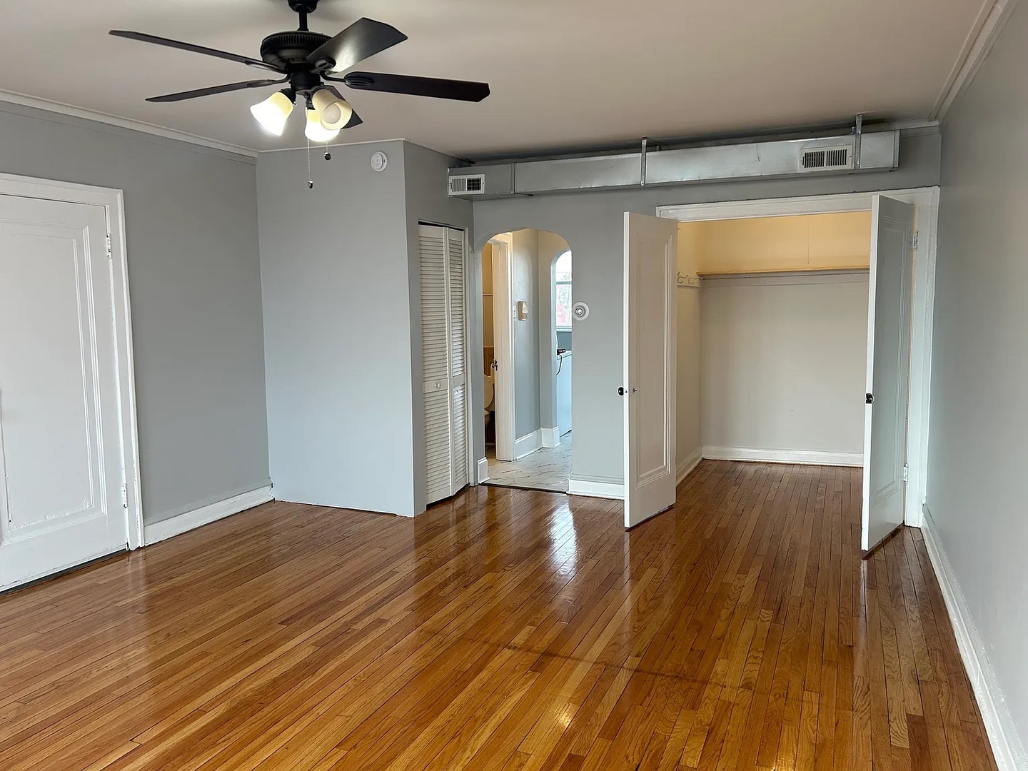 5701 West Roosevelt Road Cicero, IL 60804 - Photo 19 of 32 a view of an empty room with wooden floor and a window