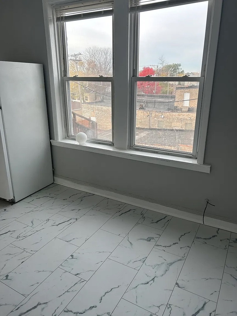 5701 West Roosevelt Road Cicero, IL 60804 - Photo 25 of 32 a view of an empty room with a window