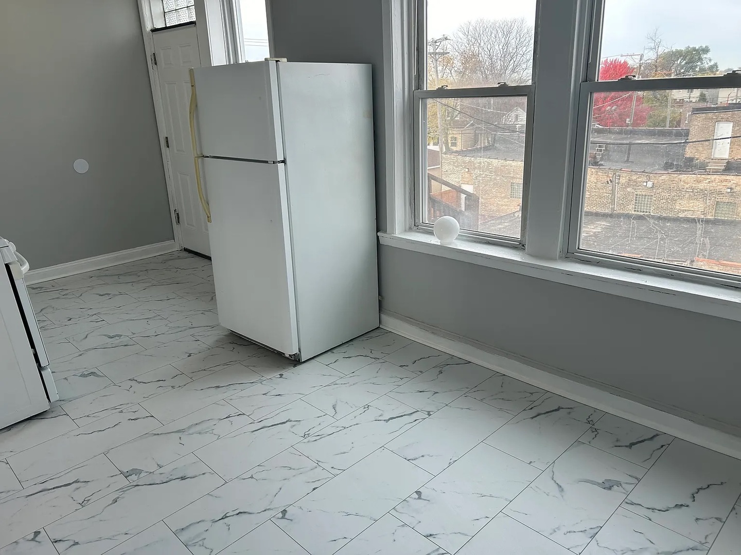 5701 West Roosevelt Road Cicero, IL 60804 - Photo 27 of 32 a view of a refrigerator in kitchen and a window