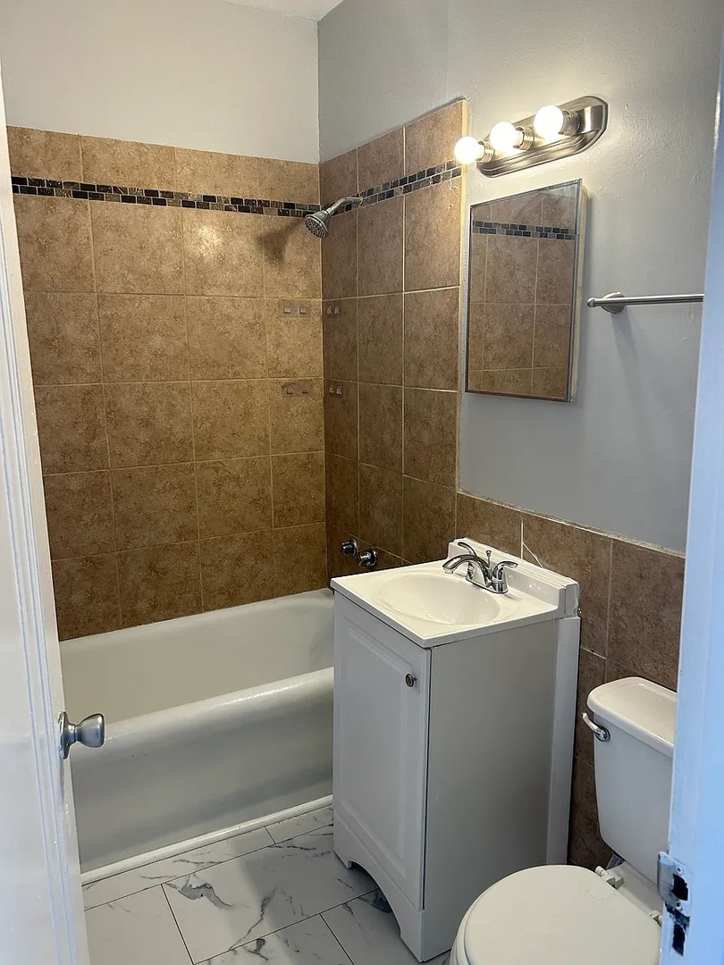 5701 West Roosevelt Road Cicero, IL 60804 - Photo 28 of 32 a bathroom with a sink toilet and shower