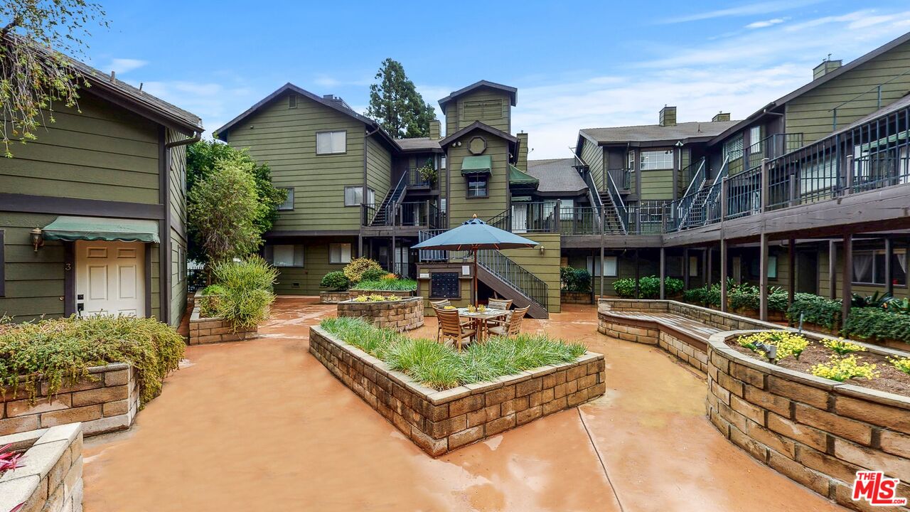 246 Alpine Street, Unit 15 Pasadena, CA 91106 - Photo 15 of 16 a front view of a house with garden