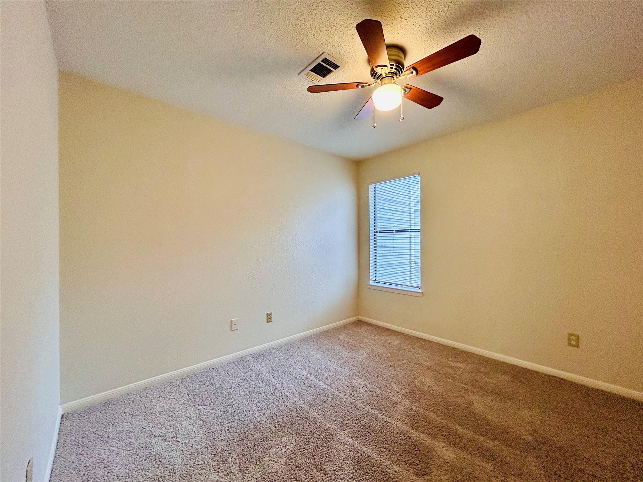 8902 Schick Road, Unit B Austin, TX 78729 - Photo 14 of 20 a view of room and window with ceiling fan