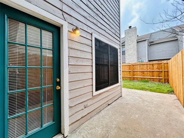 a view of a house with a yard and garage