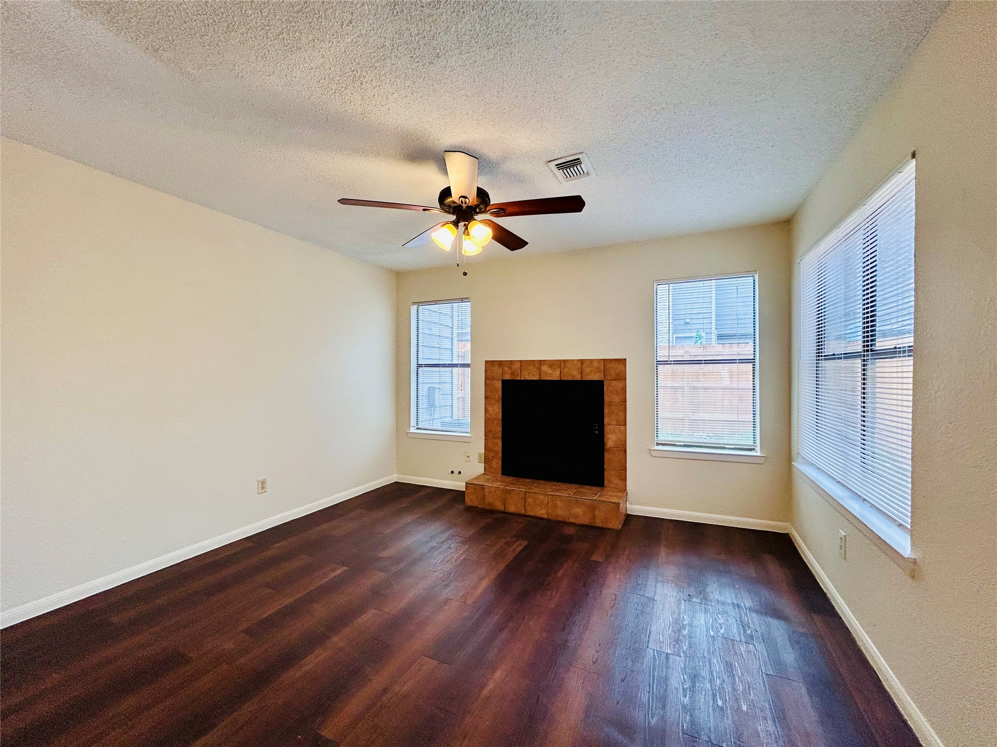 8902 Schick Road, Unit B Austin, TX 78729 - Photo 2 of 20 a view of livingroom with hardwood floor and a ceiling fan