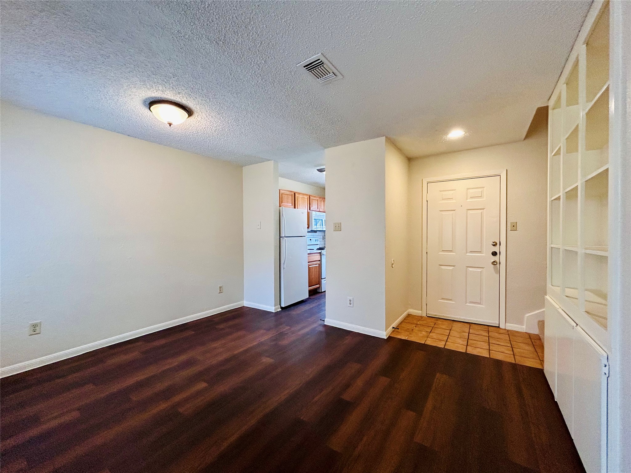 8902 Schick Road, Unit B Austin, TX 78729 - Photo 4 of 20 a view of a livingroom with wooden floor