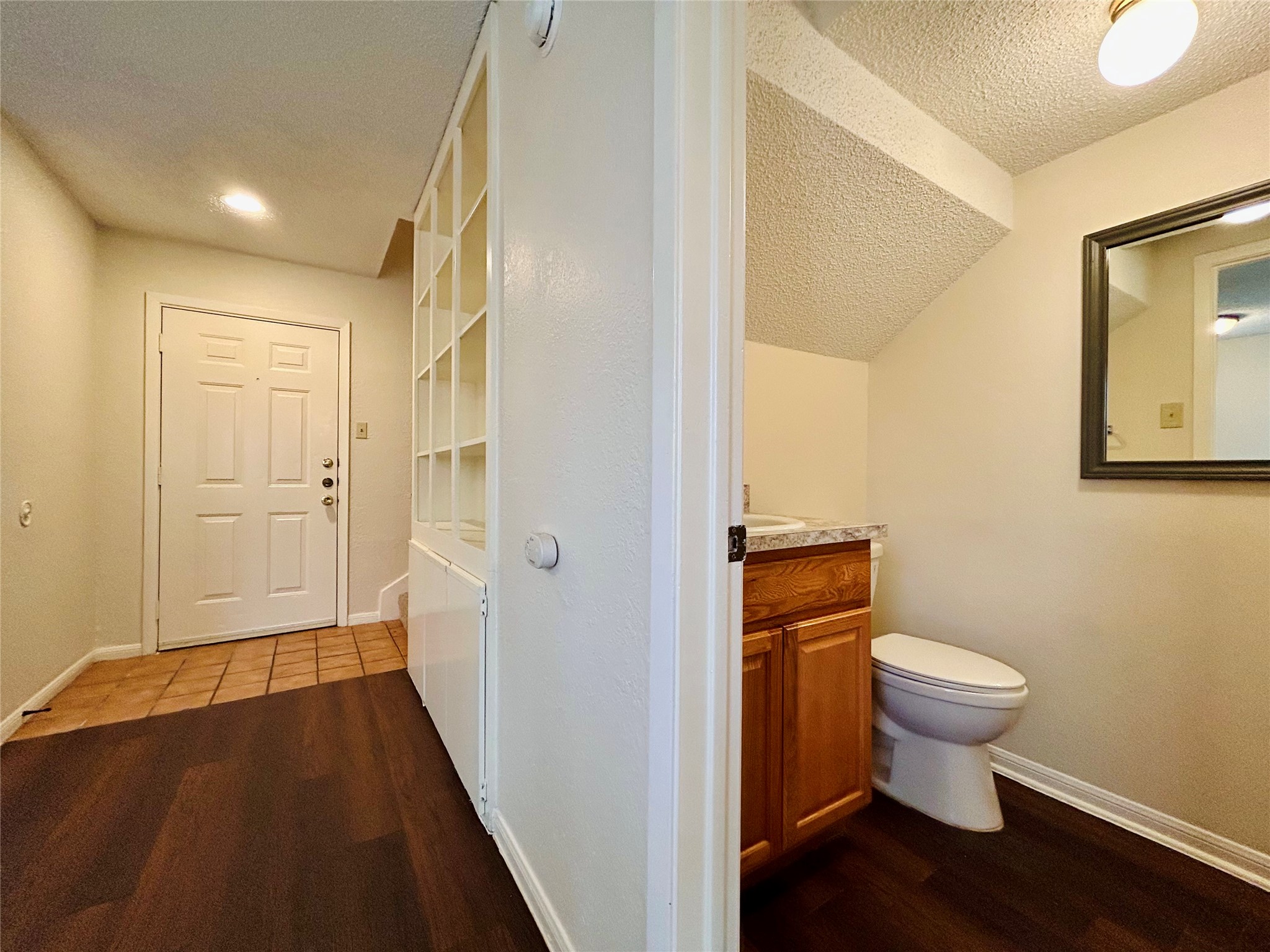 8902 Schick Road, Unit B Austin, TX 78729 - Photo 9 of 20 a bathroom with a sink and a toilet