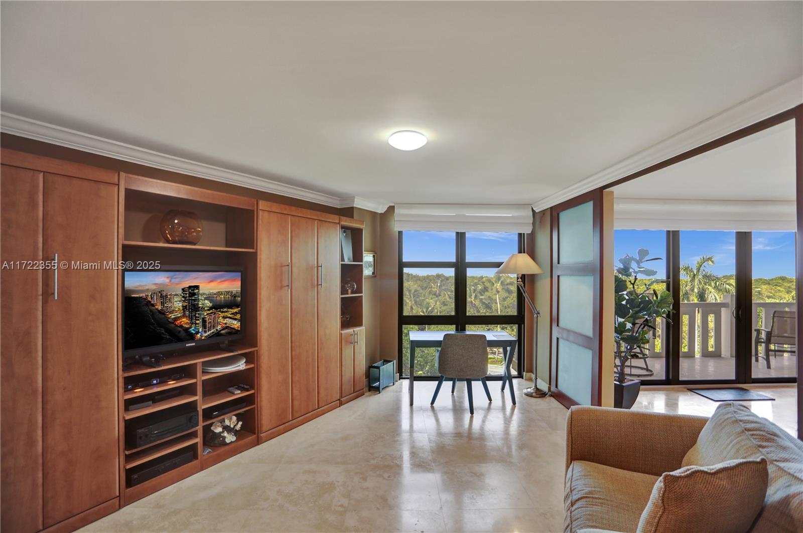 1121 Crandon Boulevard, Unit E405 Key Biscayne, FL 33149 - Photo 12 of 32 a view of a livingroom with furniture and window