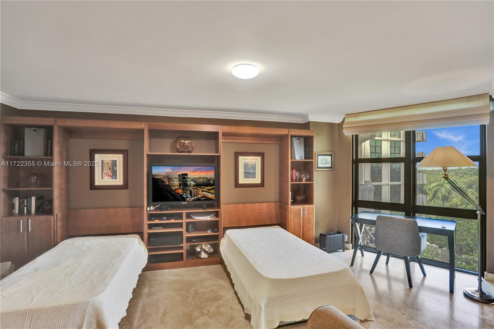 1121 Crandon Boulevard, Unit E405 Key Biscayne, FL 33149 - Photo 14 of 32 a living room with furniture a rug and wall painting