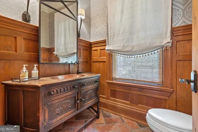 a kitchen with stainless steel appliances granite countertop a sink and cabinets