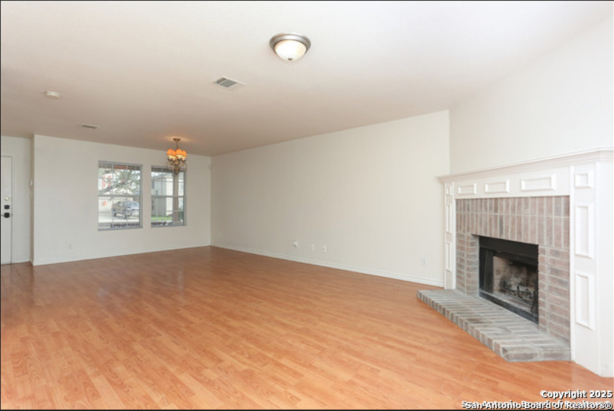 3954 Regal Rose San Antonio, TX 78259 - Photo 4 of 18 a view of empty room with fireplace