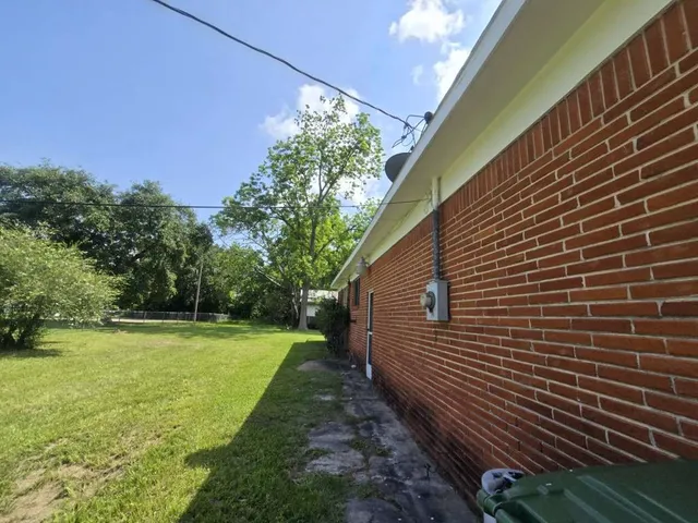 a backyard of a house with lots of green space