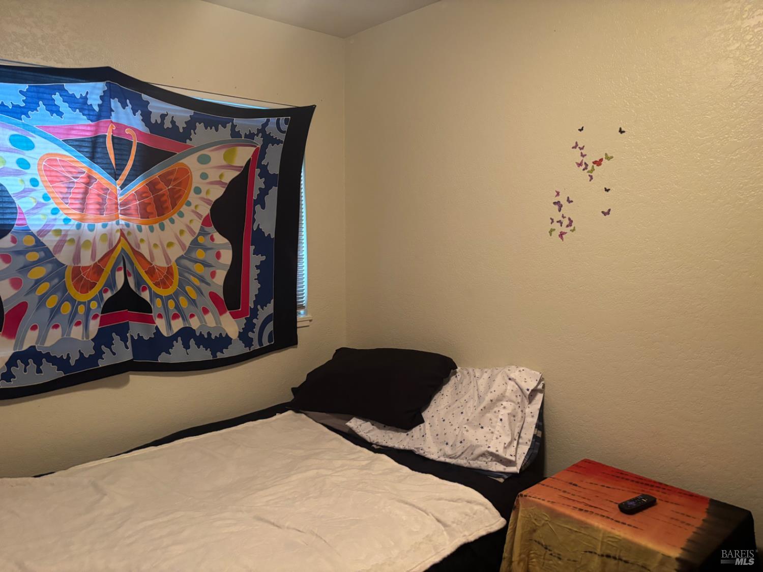 1830 Mission Boulevard Santa Rosa, CA 95409 - Photo 11 of 17 a bedroom with a bed and painting on the wall