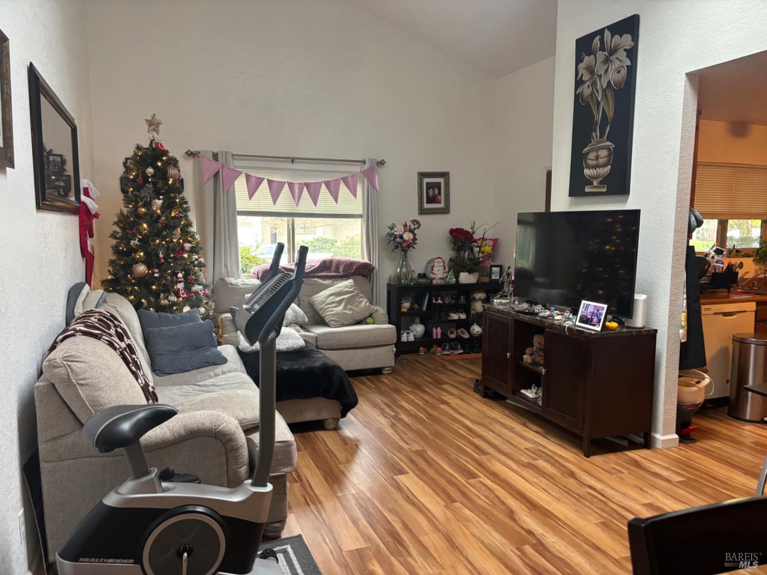 1830 Mission Boulevard Santa Rosa, CA 95409 - Photo 2 of 17 a living room with furniture fireplace and flat screen tv