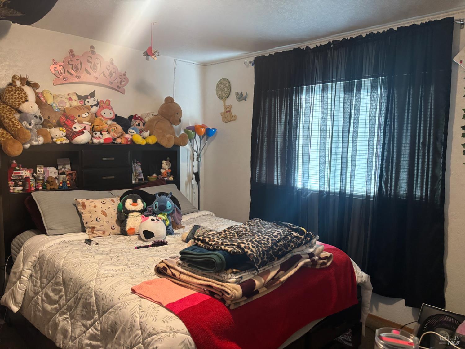 1830 Mission Boulevard Santa Rosa, CA 95409 - Photo 4 of 17 a bedroom with a bed and a window