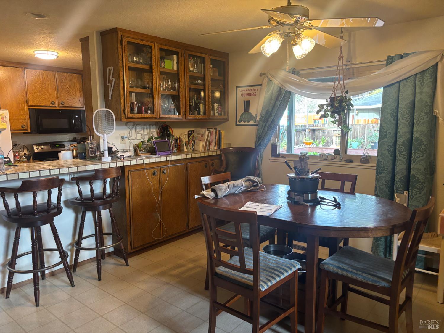 1830 Mission Boulevard Santa Rosa, CA 95409 - Photo 7 of 17 a kitchen with a dining table and chairs
