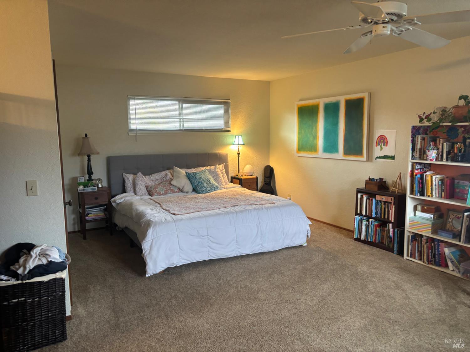 1830 Mission Boulevard Santa Rosa, CA 95409 - Photo 10 of 17 a bedroom with a bed furniture and a book shelf