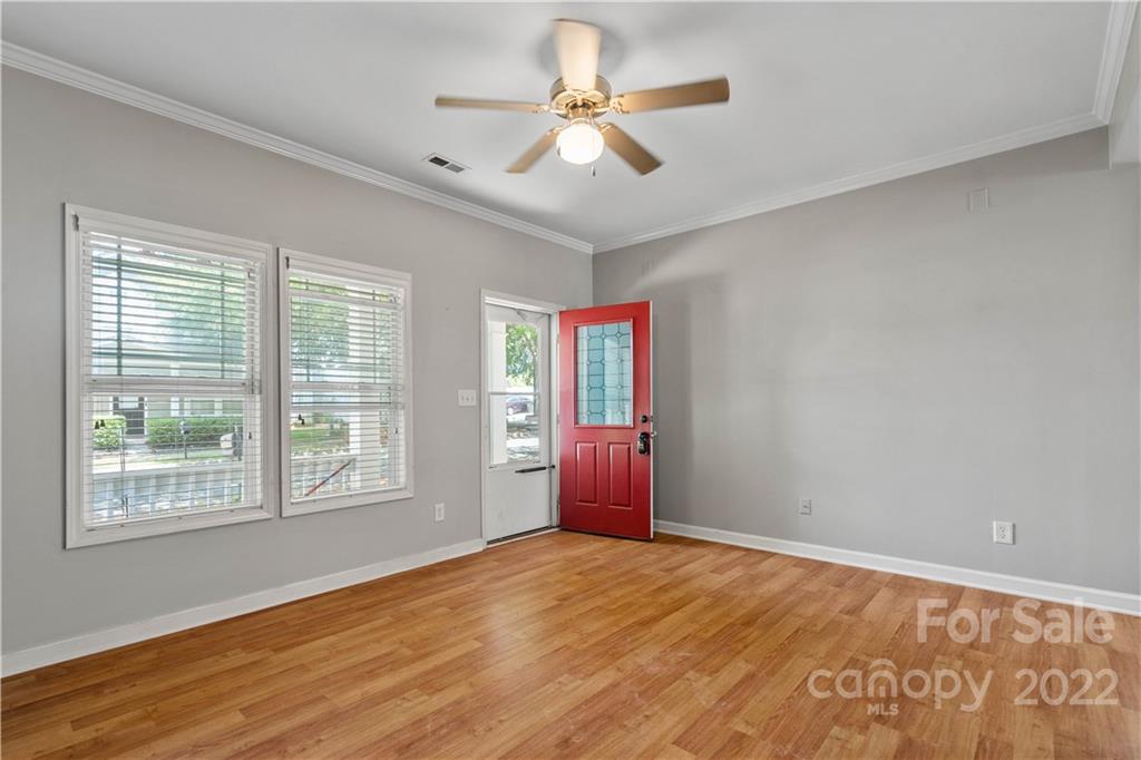 12320 Cross Meadow Road Huntersville, NC 28078 - Photo 3 of 17 a view of empty room with wooden floor and fan
