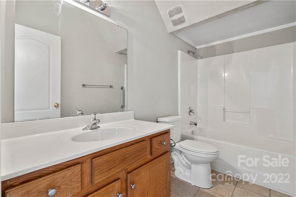 12320 Cross Meadow Road Huntersville, NC 28078 - Photo 9 of 17 a bathroom with a sink toilet a mirror and shower