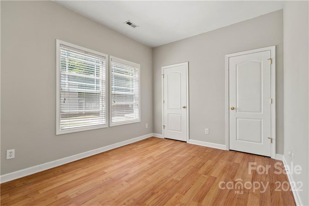 12320 Cross Meadow Road Huntersville, NC 28078 - Photo 10 of 17 a view of an empty room with wooden floor and a window