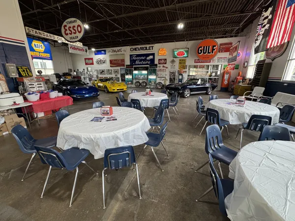 a room with lots of furniture and a chandelier