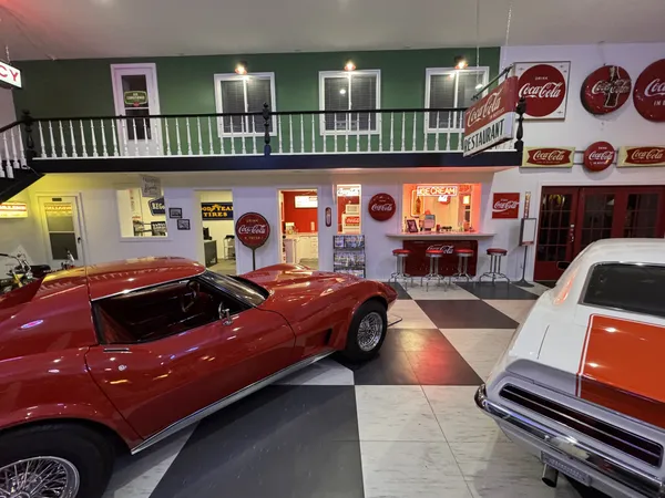 a bathroom with a toilet and a mirror