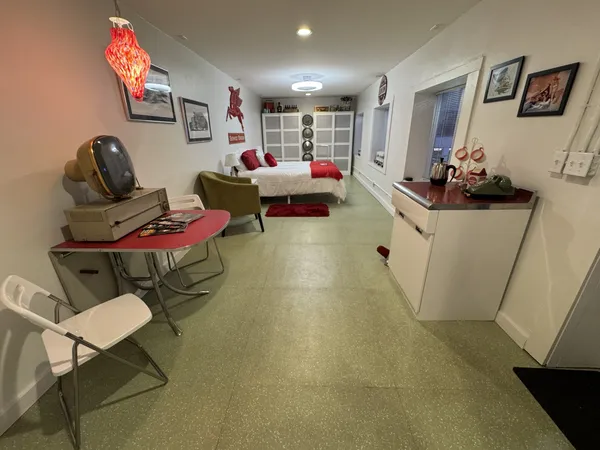 a view of living room with furniture and a flat screen tv