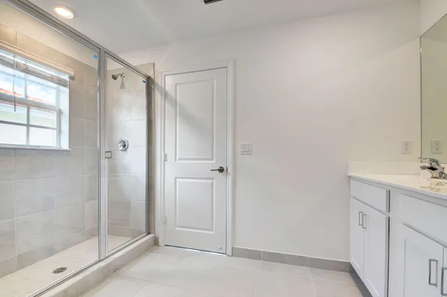 a bathroom with a shower and a sink