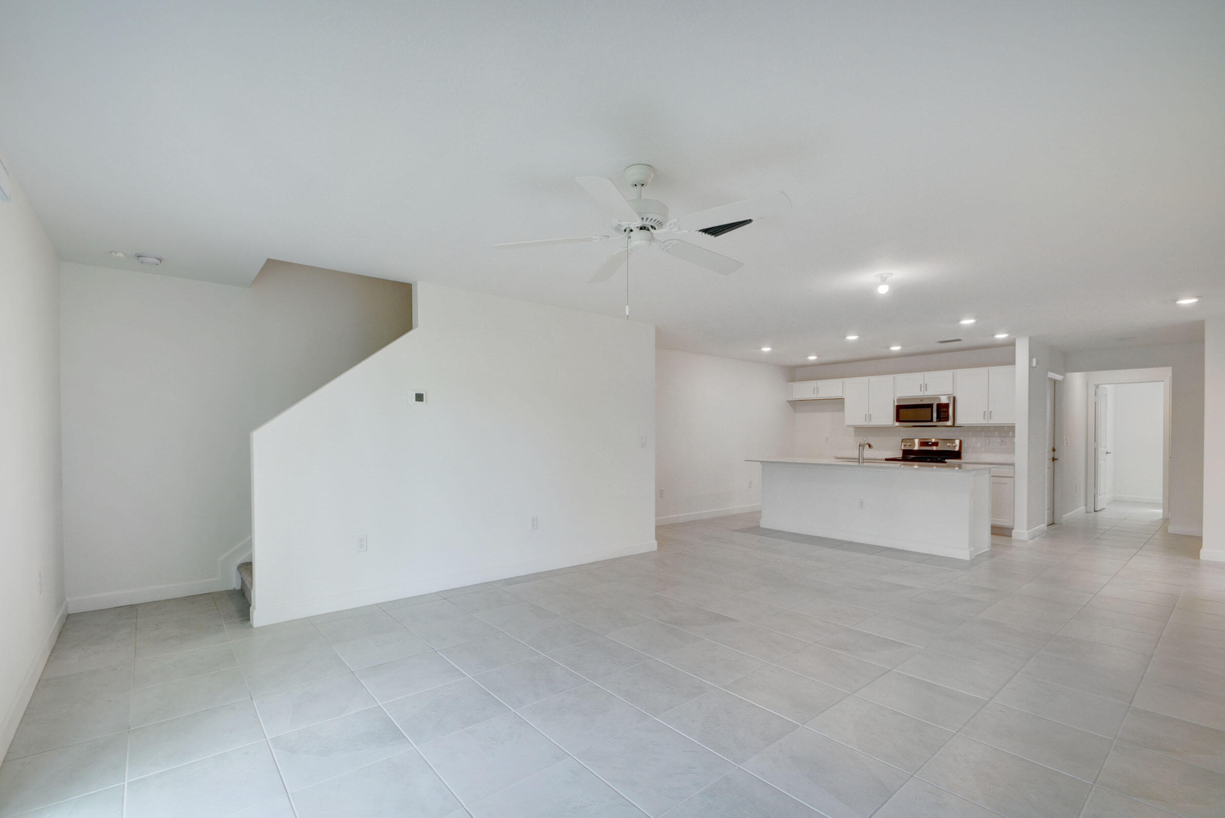 6875 Broadwater Ln Lake Lake Worth, FL 33467 - Photo 5 of 20 a view of a kitchen with a sink and a refrigerator