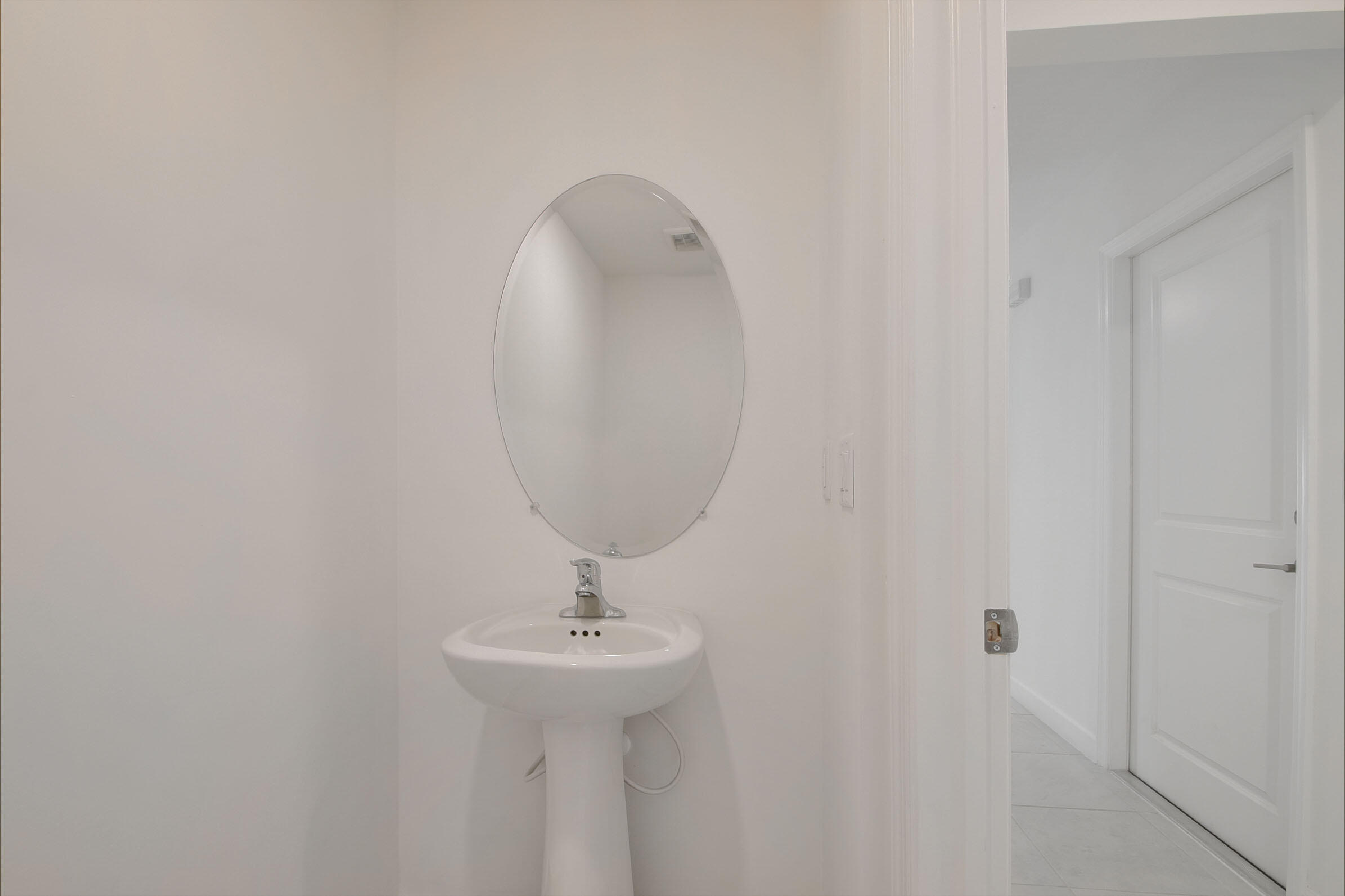6875 Broadwater Ln Lake Lake Worth, FL 33467 - Photo 7 of 20 a bathroom with a sink and mirror