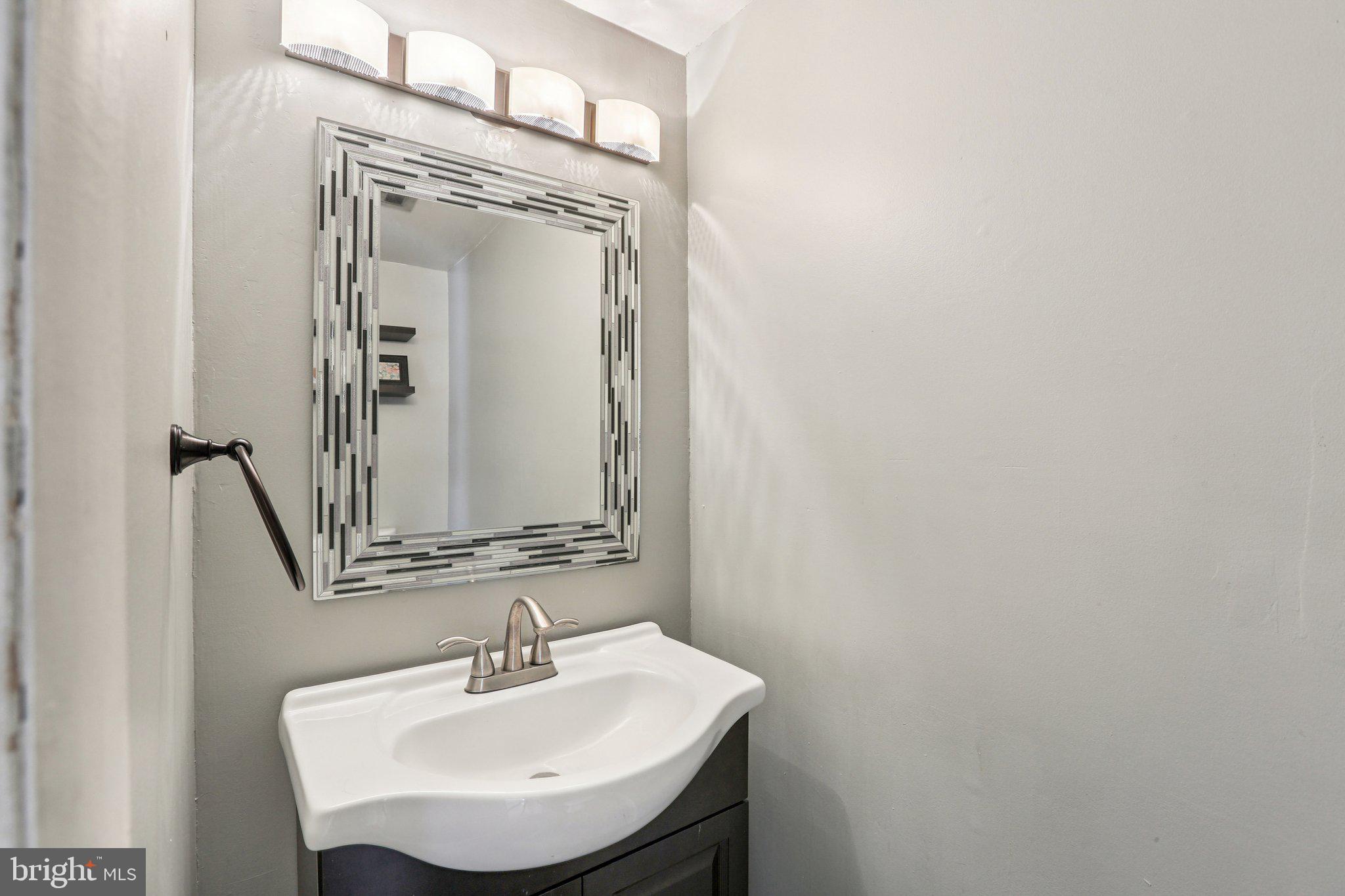 117 West Village Road Elkton, MD 21921 - Photo 12 of 37 a bathroom with a sink and a mirror