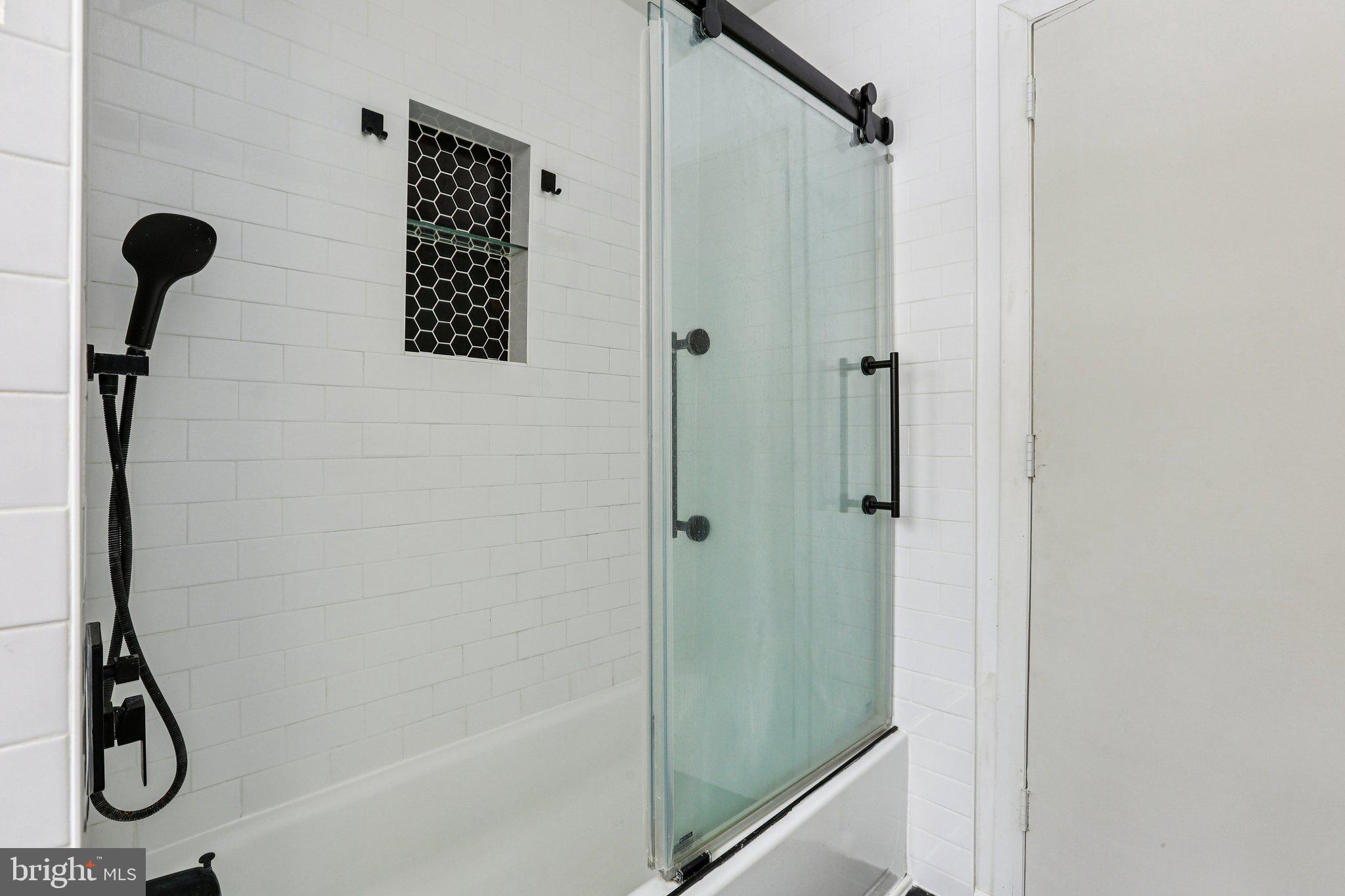 117 West Village Road Elkton, MD 21921 - Photo 23 of 37 a bathroom with a glass shower door
