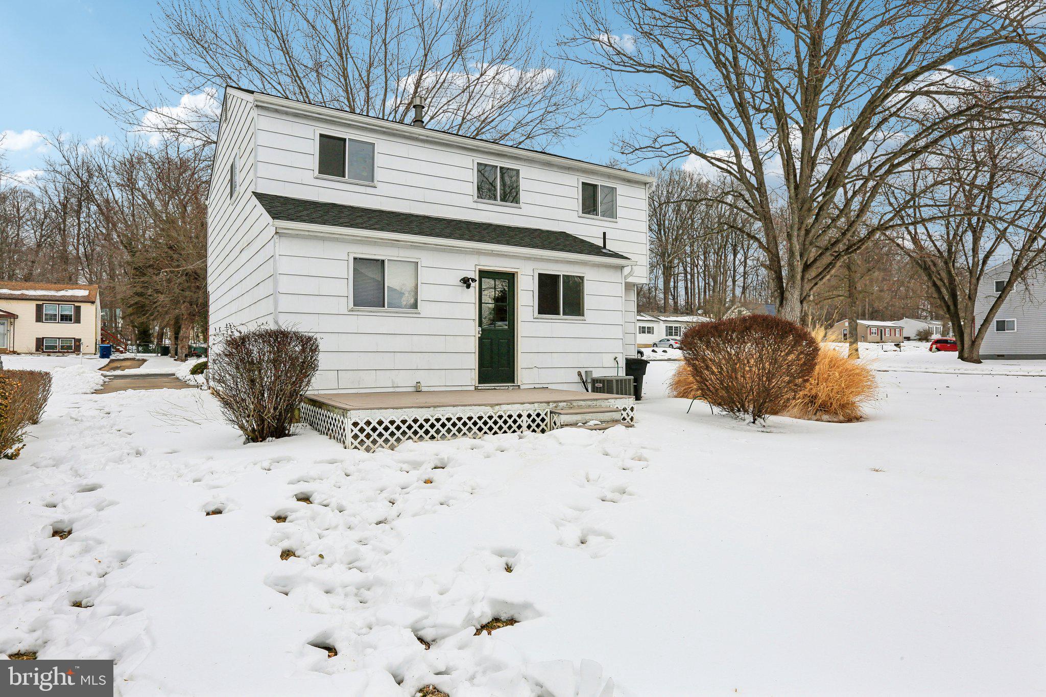 117 West Village Road Elkton, MD 21921 - Photo 30 of 37 a front view of a house with a yard covered in snow