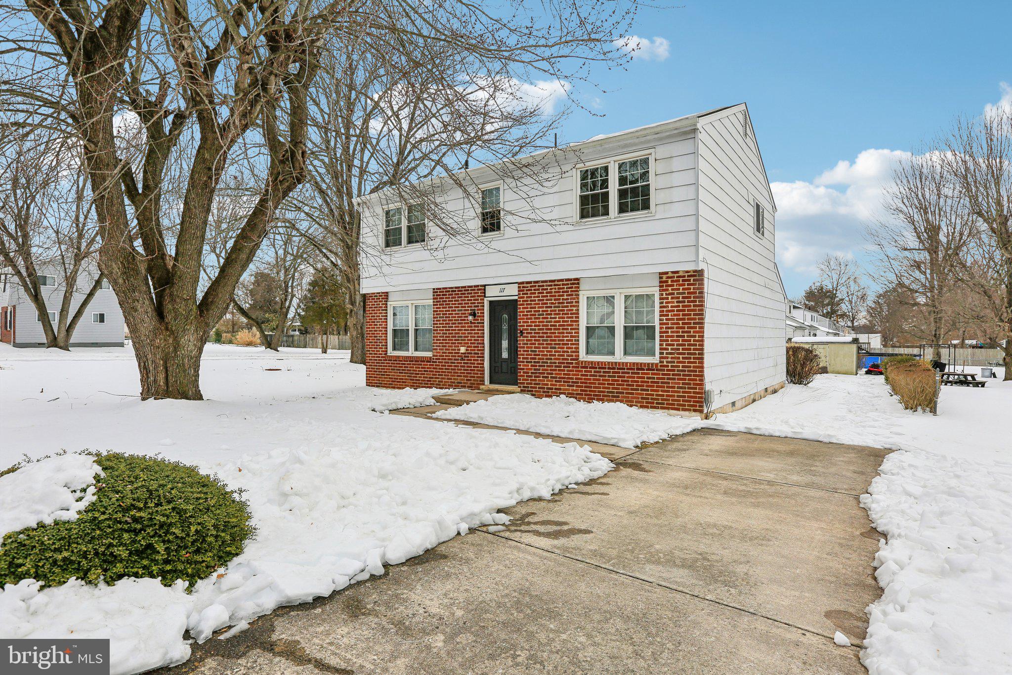 117 West Village Road Elkton, MD 21921 - Photo 35 of 37 a front view of a house with a yard covered in snow