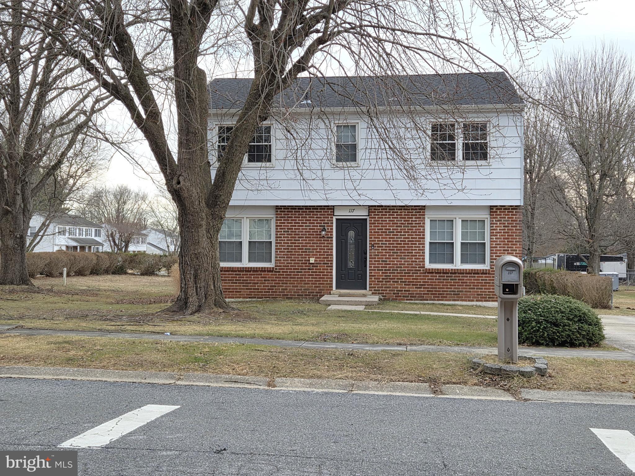 117 West Village Road Elkton, MD 21921 - Photo 37 of 37 a front view of a house with a yard and garage