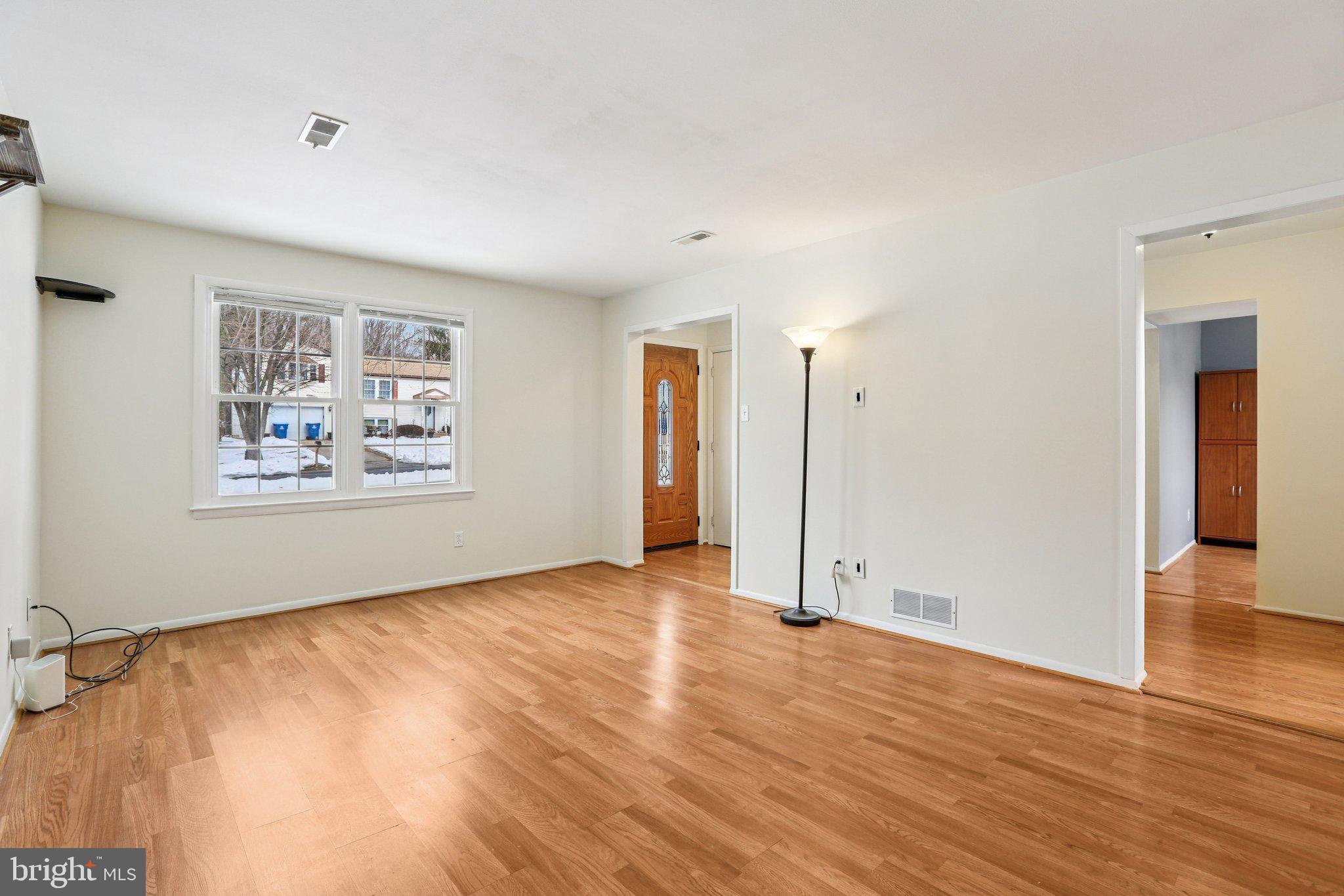 117 West Village Road Elkton, MD 21921 - Photo 5 of 37 wooden floor in an empty room with a window