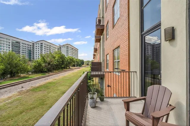 a view of balcony with two chairs and a table