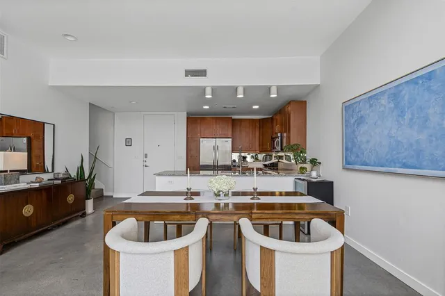 a kitchen with a sink and a refrigerator