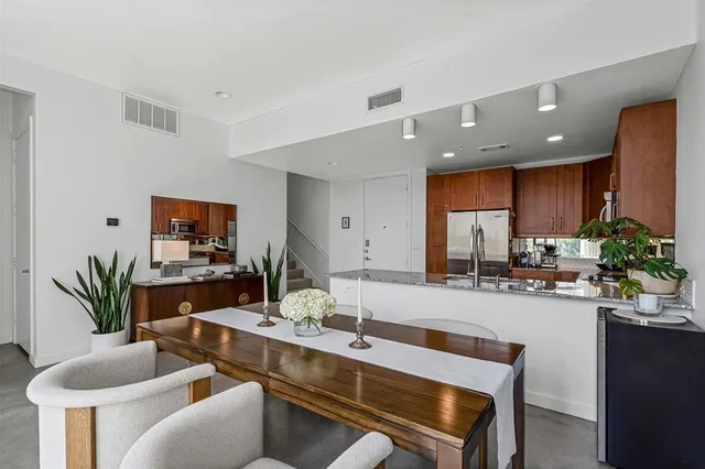 a kitchen with a table and chairs in it