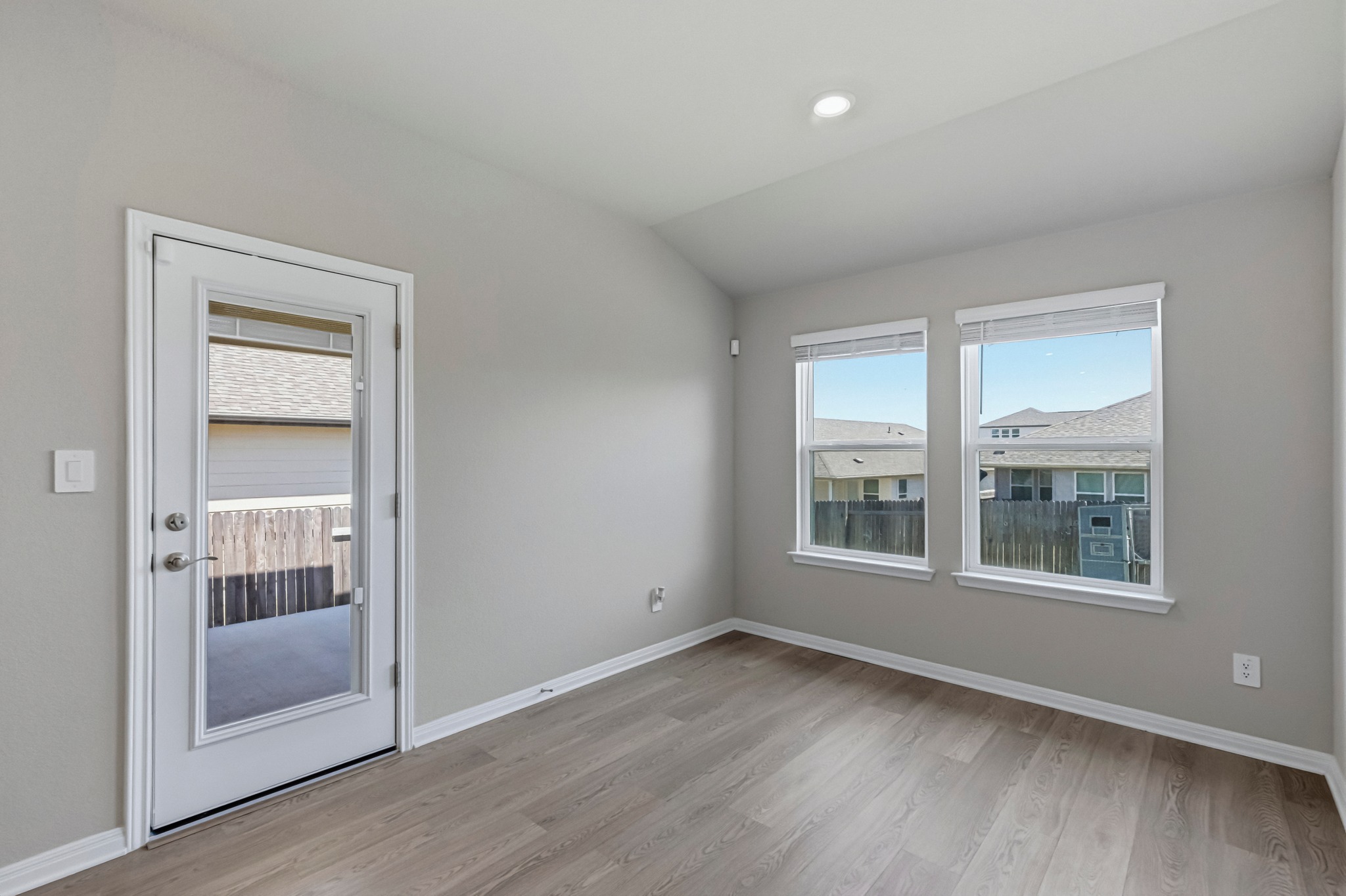 12309 Dairywork Road Buda, TX 78610 - Photo 10 of 29 Empty room featuring vaulted ceiling, light wood-style flooring, and recessed lighting