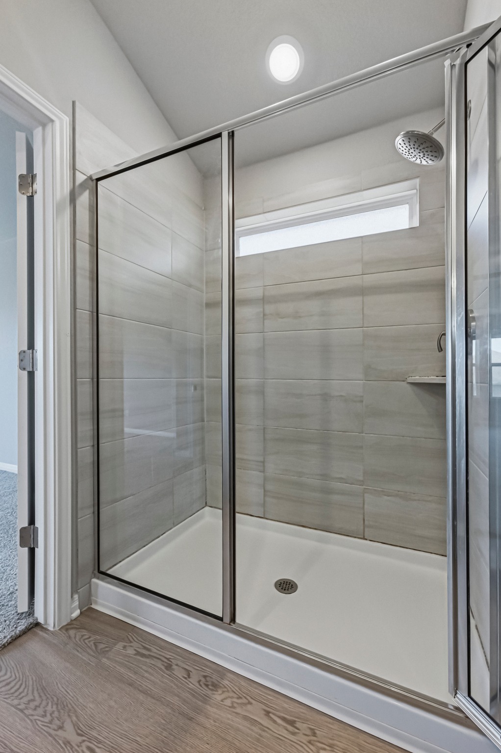 12309 Dairywork Road Buda, TX 78610 - Photo 15 of 29 Full bath featuring a shower stall and wood finished floors