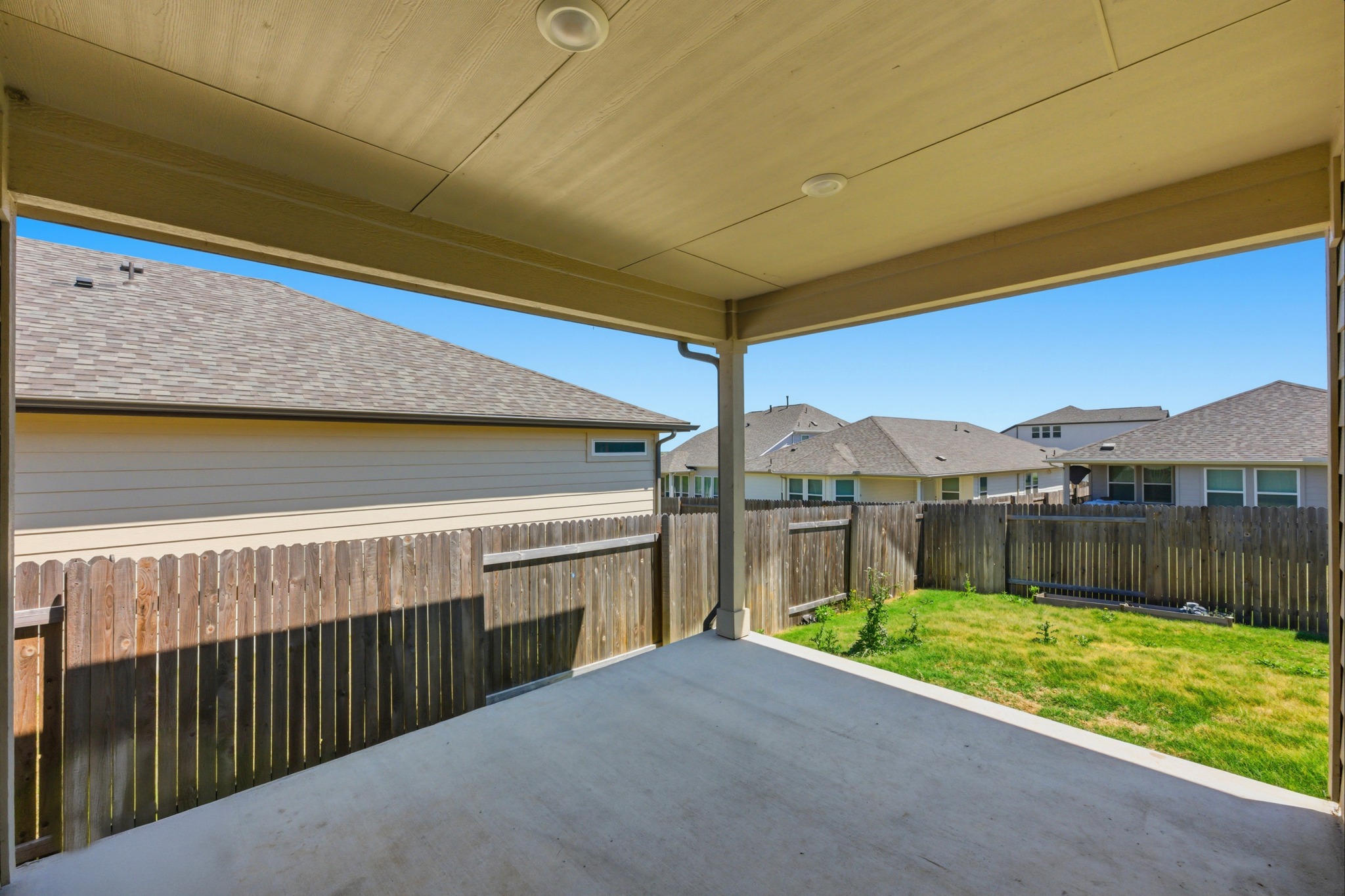 12309 Dairywork Road Buda, TX 78610 - Photo 22 of 29 Fenced backyard featuring a patio area and a residential view