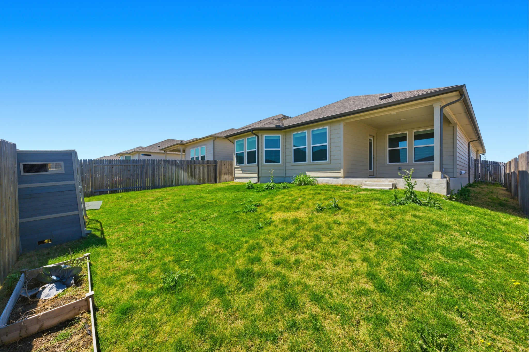 12309 Dairywork Road Buda, TX 78610 - Photo 24 of 29 Rear view of property featuring a fenced backyard and a patio