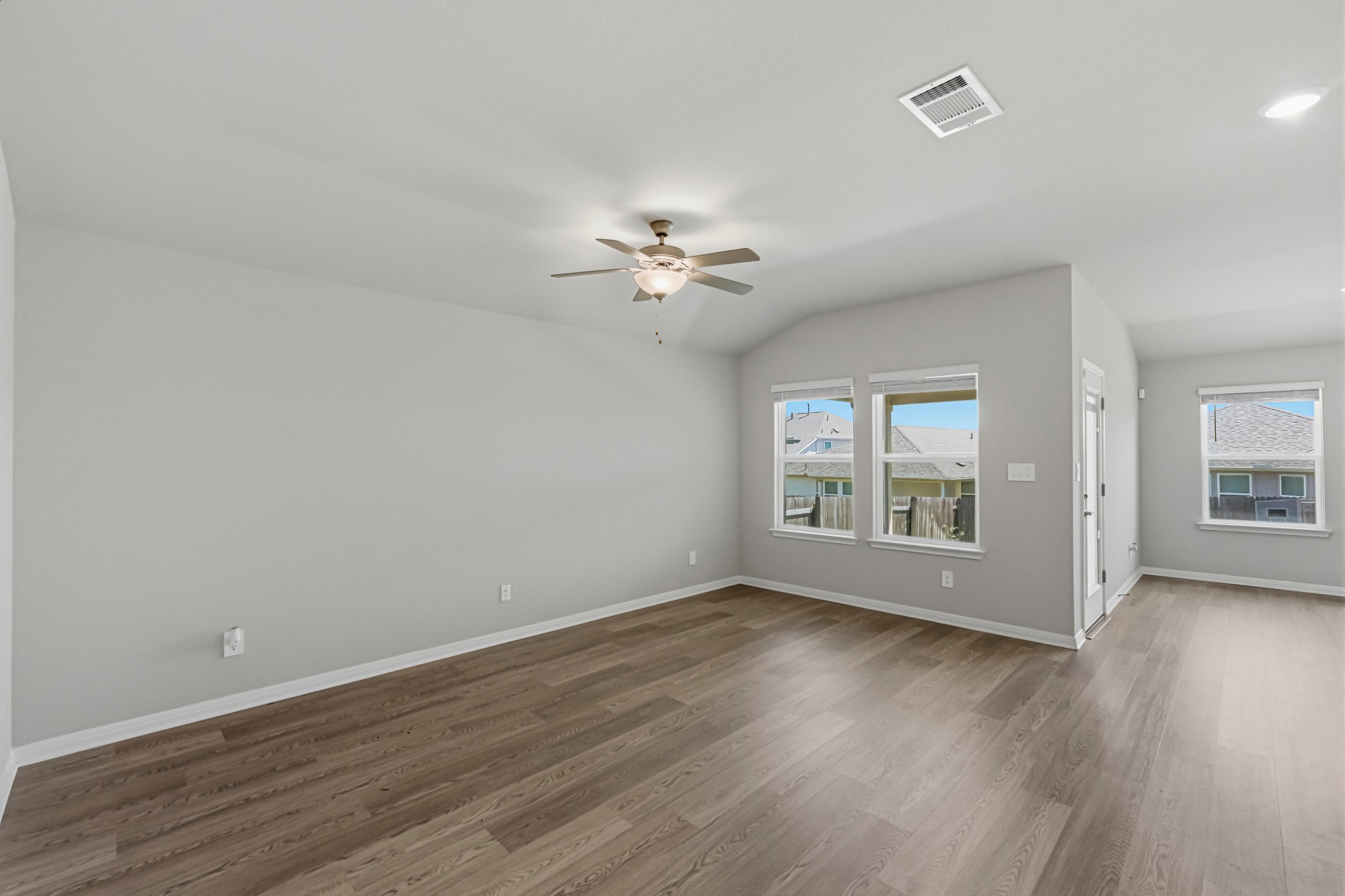 12309 Dairywork Road Buda, TX 78610 - Photo 3 of 29 Spare room with ceiling fan, dark wood-style floors, and lofted ceiling