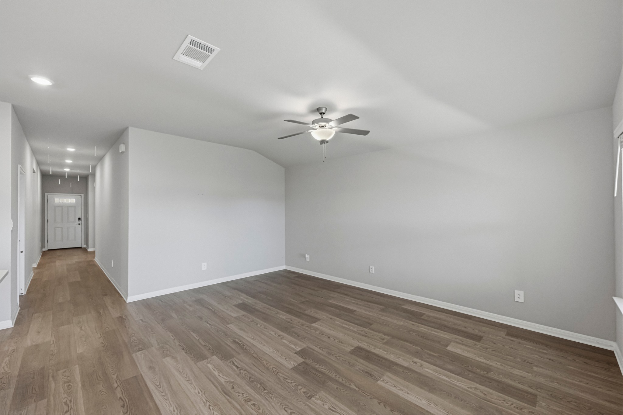 12309 Dairywork Road Buda, TX 78610 - Photo 4 of 29 Unfurnished room featuring recessed lighting, dark wood-type flooring, and a ceiling fan